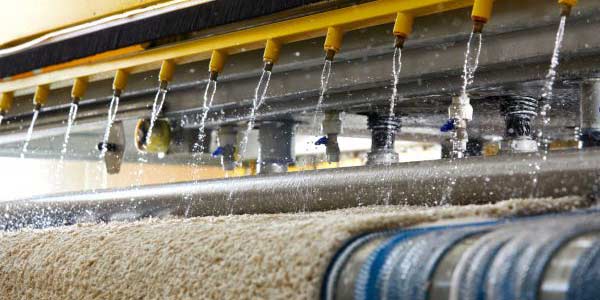 Lavage de tapis en pressing