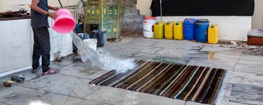 Laver un tapis à grande eau