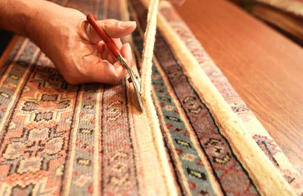 Tapis persan ancien : comment restaurer ses bords ? Retrait bordure d'un tapis persans ancien